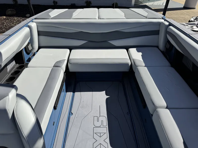 Slide: The Image of Interior of Axis A225 boat, 2026 model, featuring gray upholstery. - 13