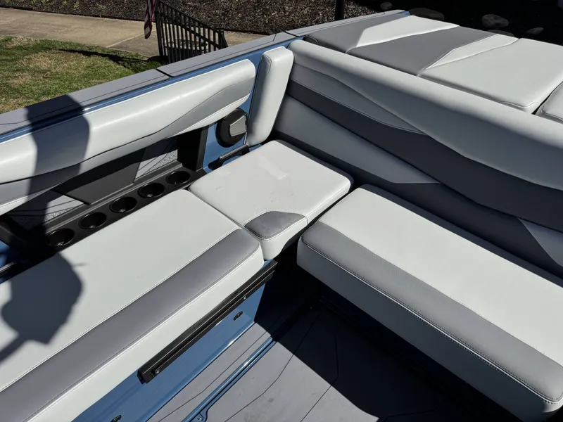 Slide: The Image of Interior of Axis A225 boat, 2026 model, featuring gray upholstery. - 14