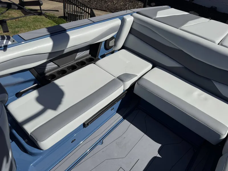 Slide: The Image of Interior of Axis A225 boat, 2026 model, featuring gray upholstery. - 16
