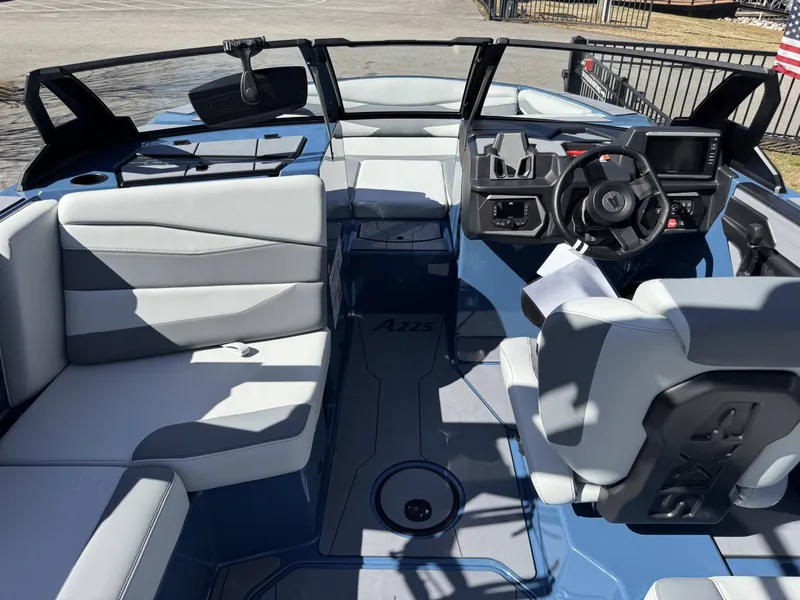 Slide: The Image of Interior of Axis A225 boat, 2026 model, featuring modern seating and control console. - 17