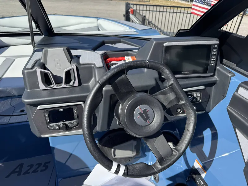 Slide: The Image of Interior view of Axis A225 boat, 2026 model, featuring steering wheel and dashboard. - 18
