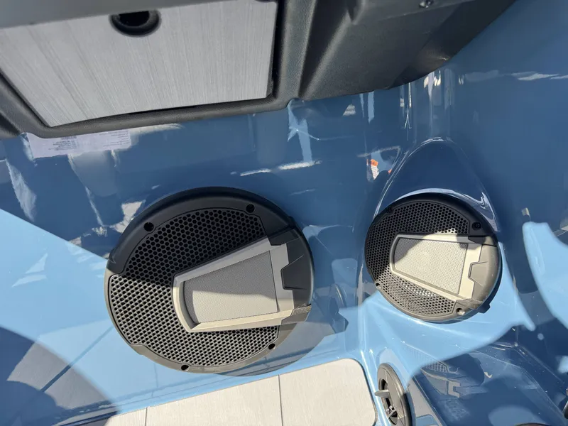 Slide: The Image of Speakers in Axis A225 boat, 2026 model, with blue interior. - 21