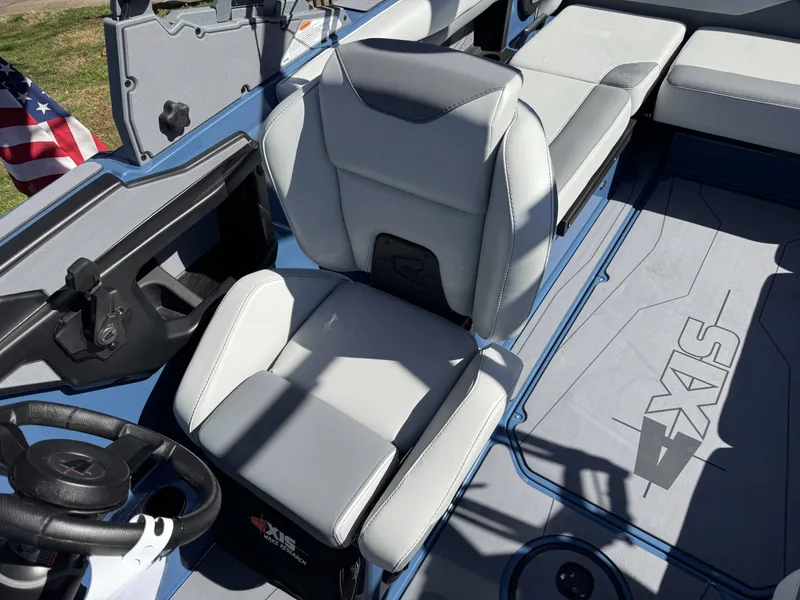 Slide: The Image of Interior of a 2026 Axis A225 boat with gray seating. - 22