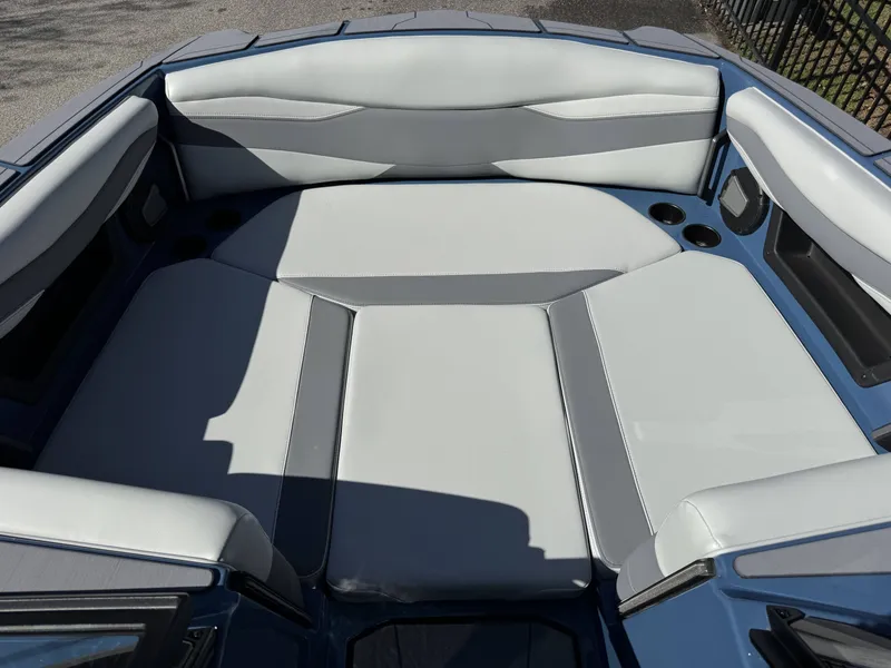 Slide: The Image of Interior of Axis A225 boat, 2026 model, featuring gray upholstery. - 23