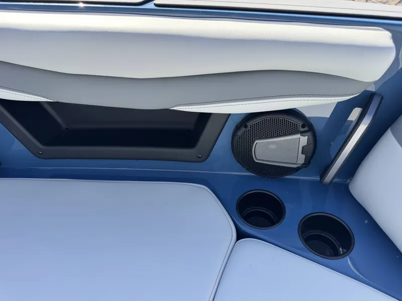 Slide: The Image of Interior of Axis A225 boat, speaker and cup holders, model year 2026. - 26