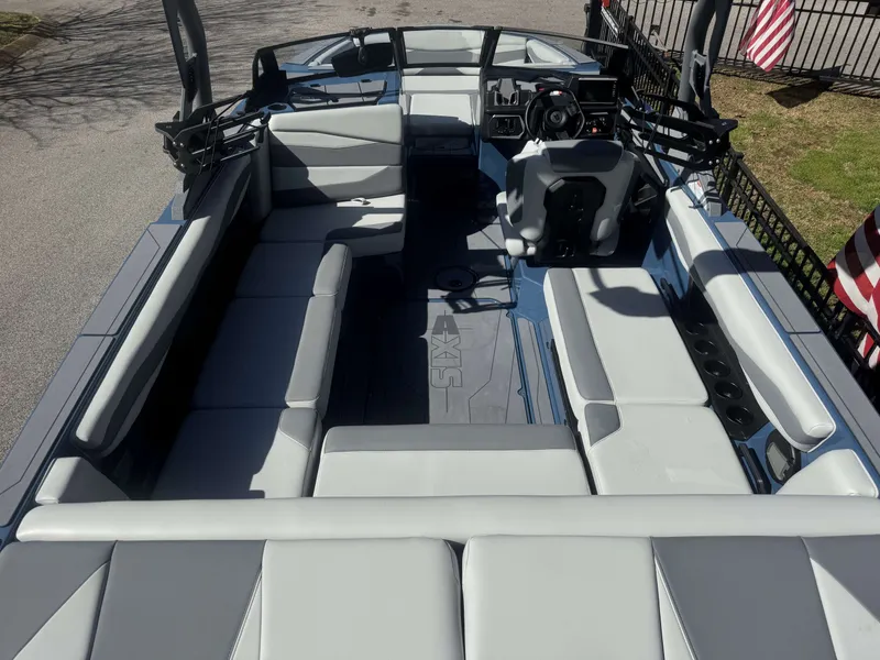 Slide: The Image of Interior of a 2026 Axis A225 boat with gray upholstery. - 3