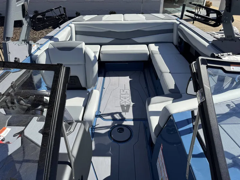 Slide: The Image of Interior of Axis A225 boat, 2026 model, featuring gray upholstery. - 31