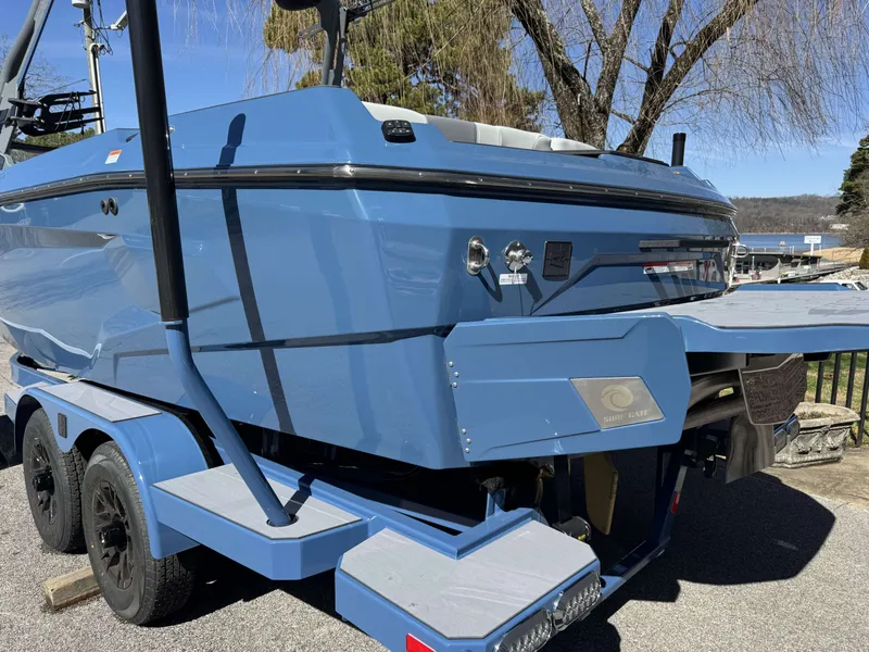 Slide: The Image of Blue Axis A225 boat from 2026 parked on trailer. - 36