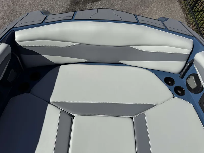 Slide: The Image of Interior of Axis A225 boat, 2026 model, featuring gray upholstery. - 5