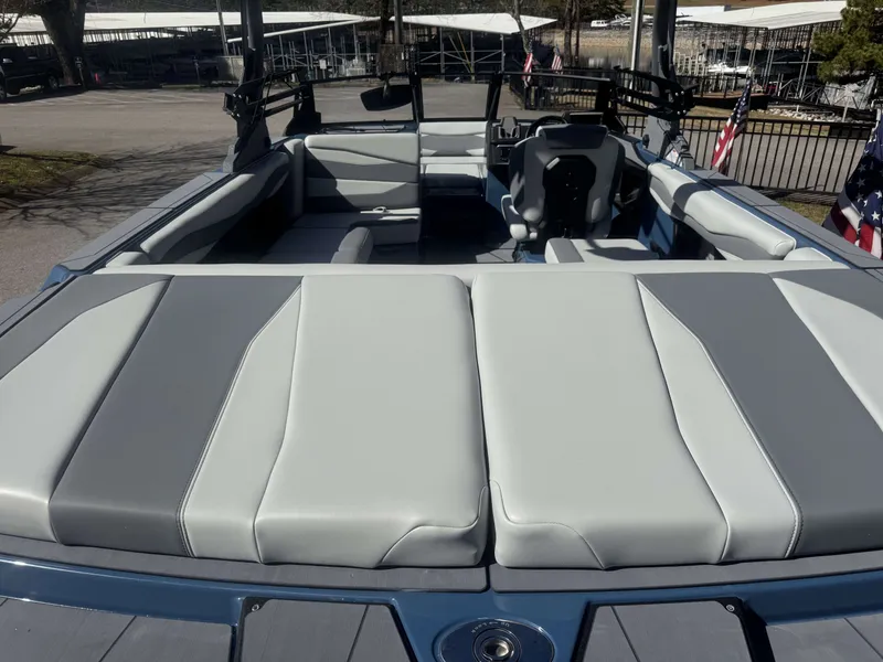 Slide: The Image of Interior of Axis A225 boat, 2026 model, featuring gray upholstery. - 9