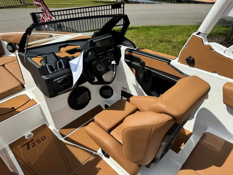 Slide: The Image of Interior of Axis T250 boat, 2026 model, featuring brown leather seats. - 14