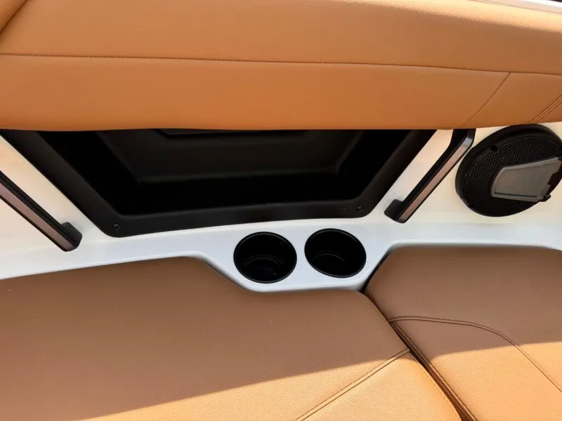 Slide: The Image of Interior of 2026 Axis T250 with speaker and cup holders. - 18