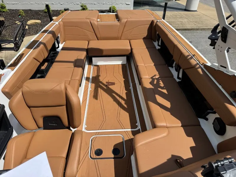 Slide: The Image of Interior of Axis T250 boat, 2026, featuring brown leather seating. - 20