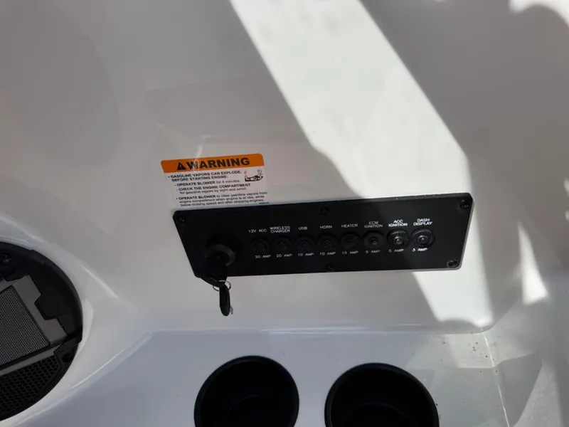Slide: The Image of Axis T250 boat control panel with warning label, 2026 model. - 24