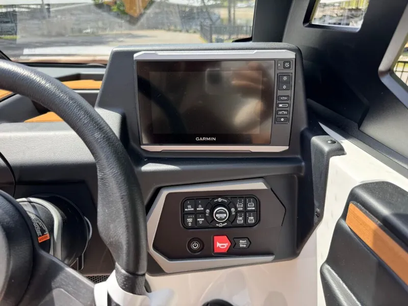 Slide: The Image of 2026 Axis T250 boat dashboard with Garmin display and controls. - 25