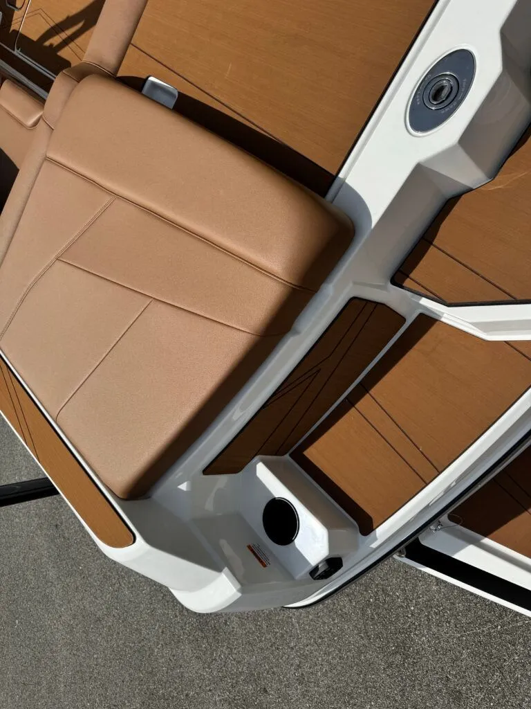 Slide: The Image of Axis T250 2026 boat with brown upholstery and white frame. - 4