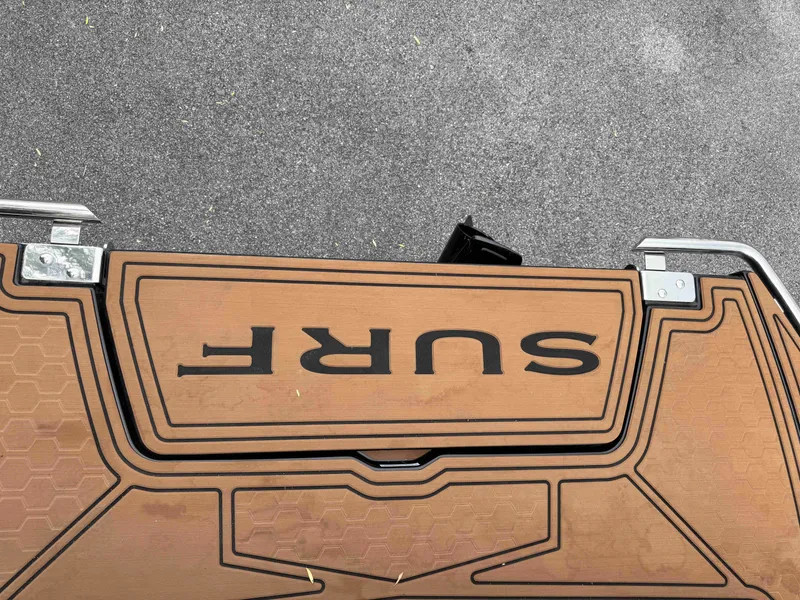 Slide: The Image of Cobalt R6 Surf 2026 boat with surf logo on brown deck. - 37