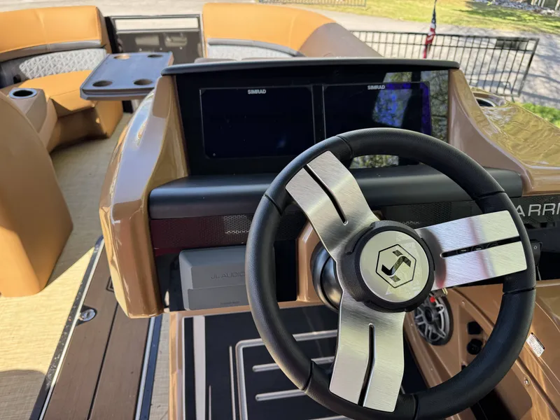 Slide: The Image of Interior view of 2026 Harris Solstice 230 SLDH with modern steering wheel. - 10