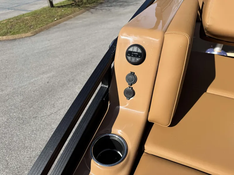 Slide: The Image of Interior of 2026 Harris Solstice 230 SLDH with controls and cup holder. - 3