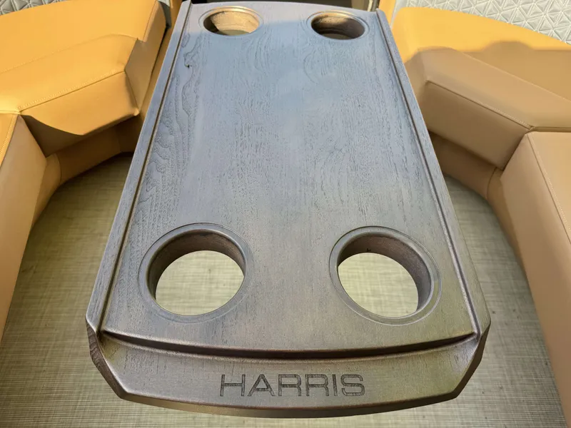 Slide: The Image of Harris Solstice 230 SLDH 2026 table with cup holders on boat. - 4