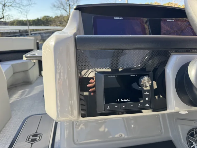Slide: The Image of 2026 Harris Solstice 230 SLDH boat console with JL Audio system. - 11