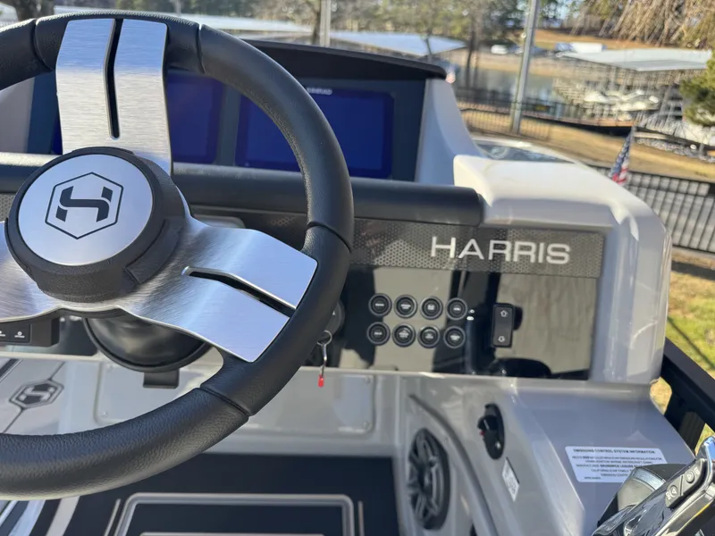Slide: The Image of Steering wheel of 2026 Harris Solstice 230 SLDH with control console. - 12