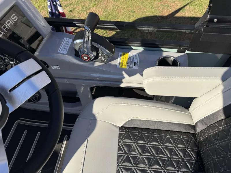 Slide: The Image of Interior of 2026 Harris Solstice 230 SLDH with steering and seat. - 13