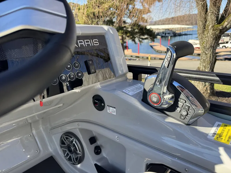 Slide: The Image of Interior view of Harris Solstice 230 SLDH 2026 helm at marina. - 14