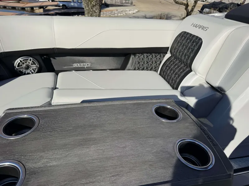 Slide: The Image of Interior of 2026 Harris Solstice 230 SLDH with luxurious seating and table. - 20