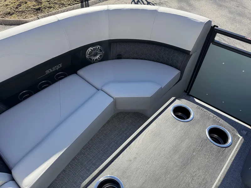 Slide: The Image of Interior of 2026 Harris Solstice 230 SLDH with seating and cup holders. - 25