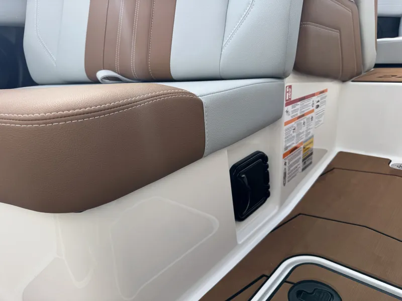 Slide: The Image of 2026 Malibu Wakesetter 22 LSV interior with brown and gray seating. - 13