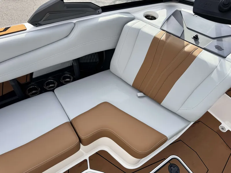 Slide: The Image of 2026 Malibu Wakesetter 22 LSV interior with brown and white seating. - 15