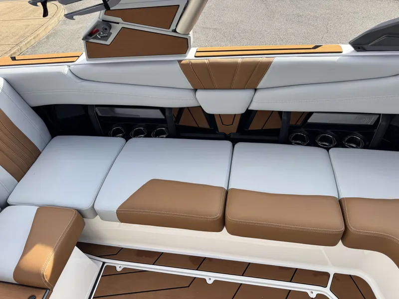 Slide: The Image of 2026 Malibu Wakesetter 22 LSV interior with brown and white seating. - 16