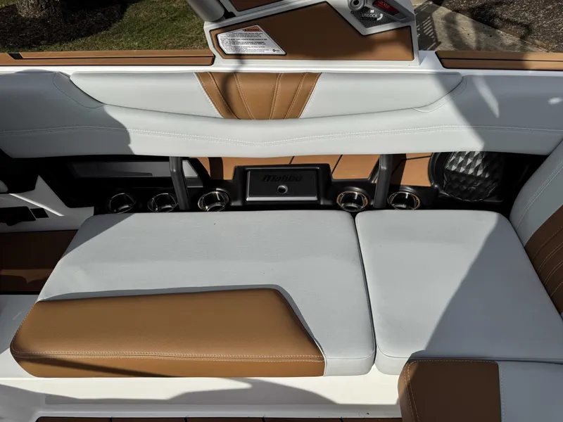 Slide: The Image of Interior of 2026 Malibu Wakesetter 22 LSV with brown and white seating. - 17