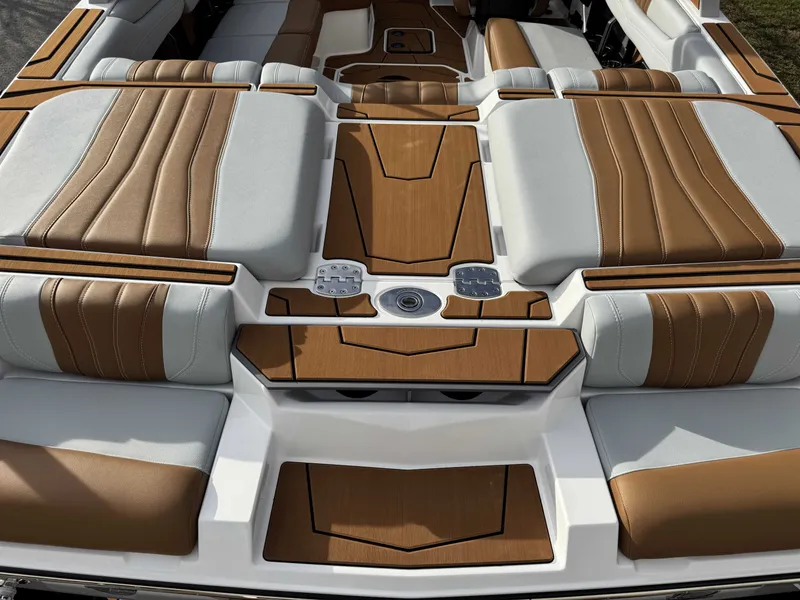 Slide: The Image of Interior of 2026 Malibu Wakesetter 22 LSV with brown and gray upholstery. - 24