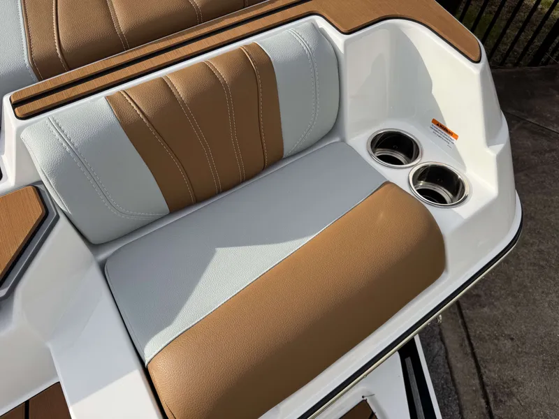 Slide: The Image of 2026 Malibu Wakesetter 22 LSV seating area with cup holders. - 26