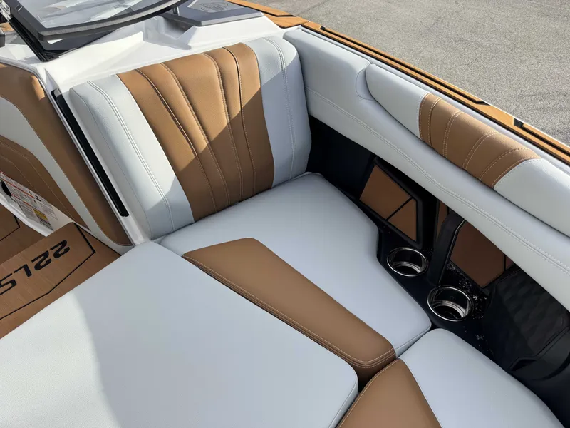 Slide: The Image of 2026 Malibu Wakesetter 22 LSV interior with brown and white seating. - 30