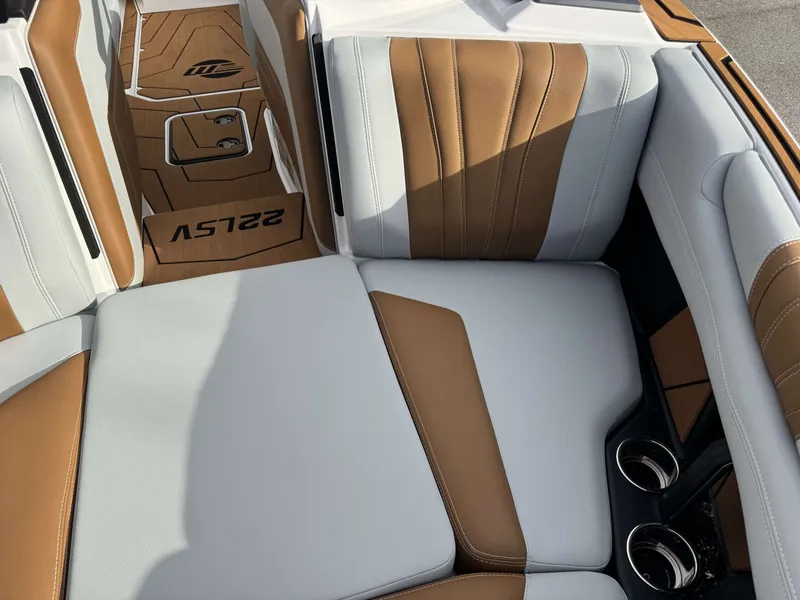 Slide: The Image of 2026 Malibu Wakesetter 22 LSV interior with brown and gray seating. - 32