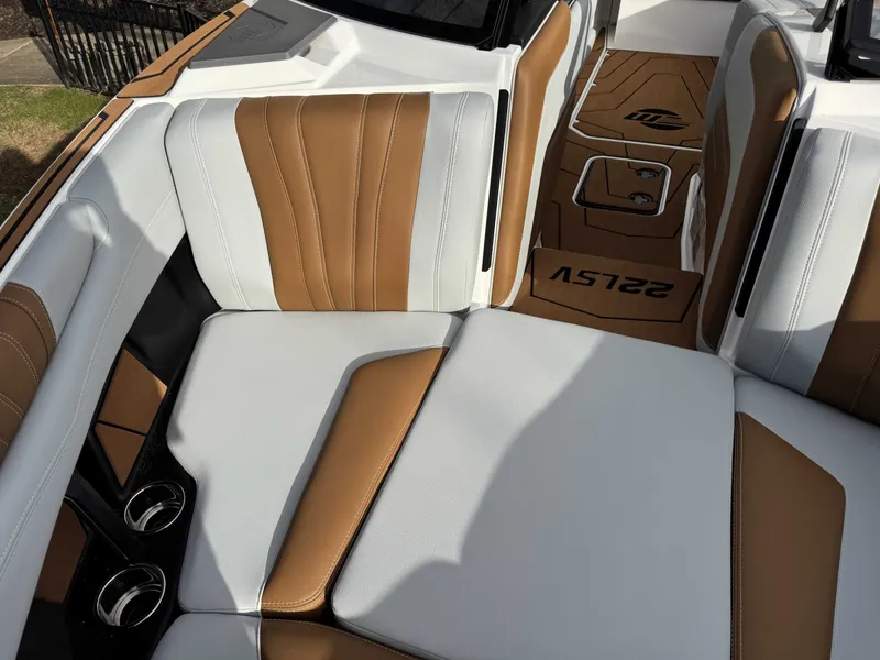 Slide: The Image of Interior of 2026 Malibu Wakesetter 22 LSV with brown and white seating. - 33