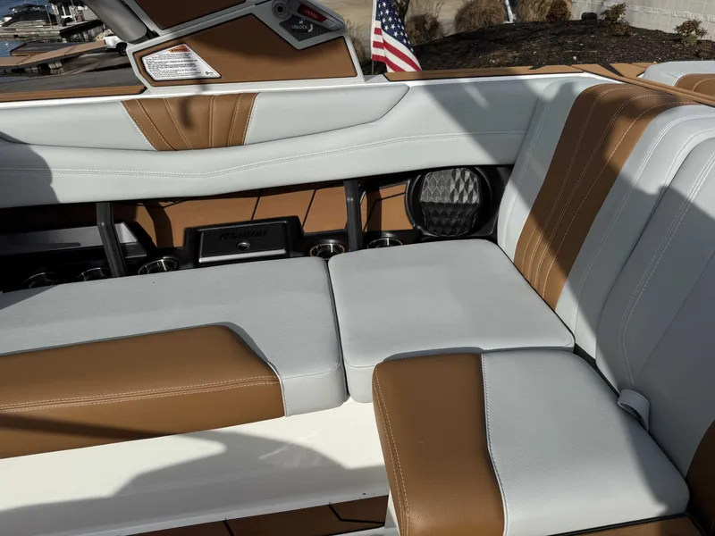 Slide: The Image of 2026 Malibu Wakesetter 22 LSV interior with brown and white seating. - 34