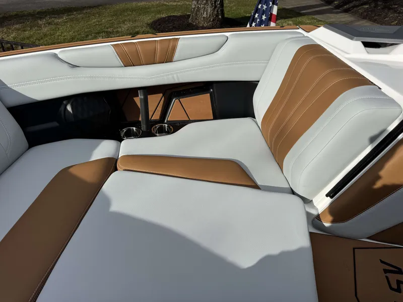 Slide: The Image of 2026 Malibu Wakesetter 22 LSV interior with brown and white seating. - 8