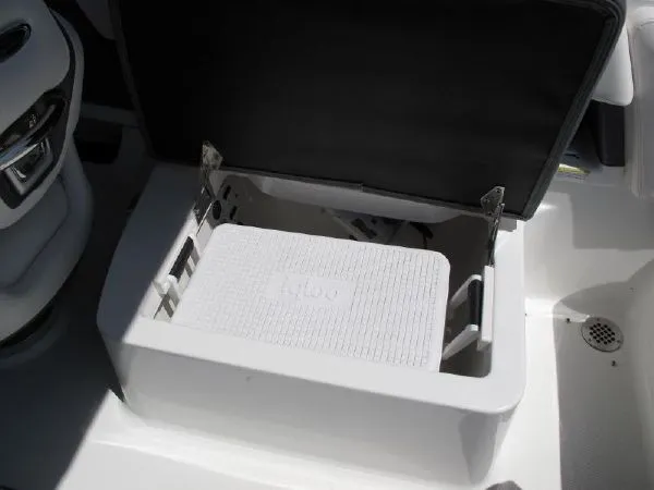 Slide: The Image of Open storage compartment on a 2023 SAMPLE New Boat model. - 10