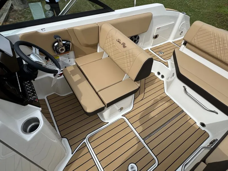 Slide: The Image of Interior of 2026 Sea Ray SDO 230 boat with beige seating. - 31
