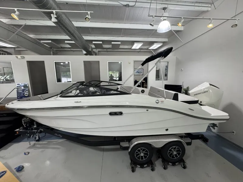 The Image of 2026 Sea Ray SPO210 boat in showroom. - 1