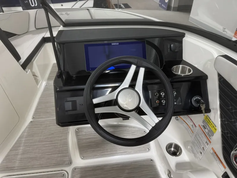 Slide: The Image of Interior view of Sea Ray SPO210 boat cockpit, model year 2026. - 10