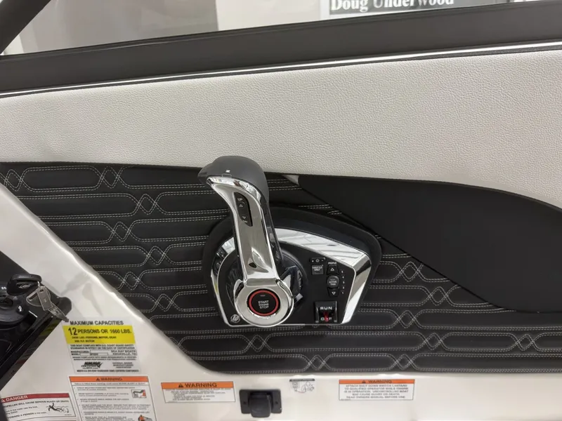 Slide: The Image of Interior view of Sea Ray SPO210 2026 throttle control. - 11