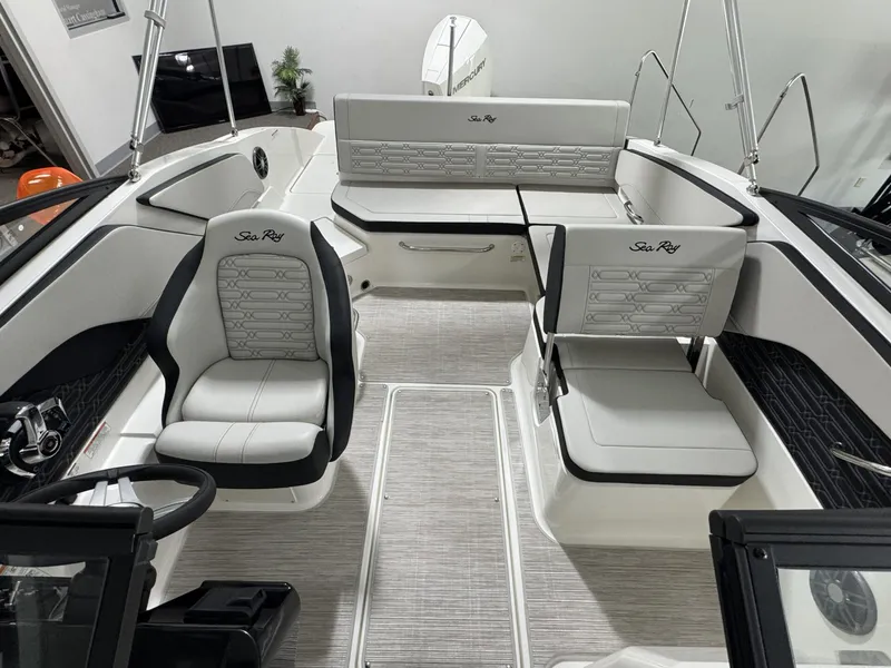 Slide: The Image of Interior of 2026 Sea Ray SPO210 boat, featuring modern seats and console. - 19