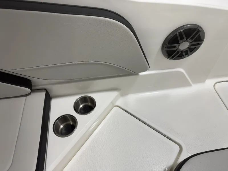 Slide: The Image of Interior of 2026 Sea Ray SPO210 with speaker and cup holders. - 21