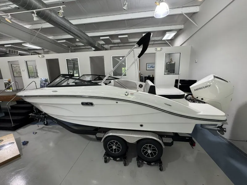 Slide: The Image of 2026 Sea Ray SPO210 boat in showroom on trailer. - 3