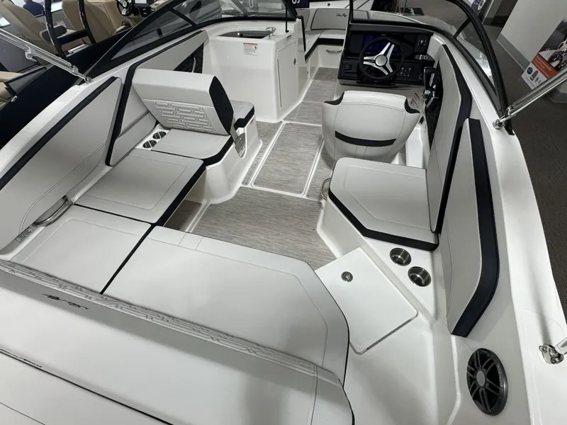 Slide: The Image of Interior of 2026 Sea Ray SPO210 boat, featuring modern seating and helm. - 5